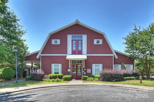 10906 Angler Ct, Davidson, NC 28036 - colonial inspired home featuring a gambrel roof and french doors