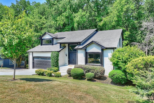 9334 Hunting Ct, Matthews, NC 28105 - split level home with an attached garage, a front yard, concrete driveway, a shingled roof, and brick siding