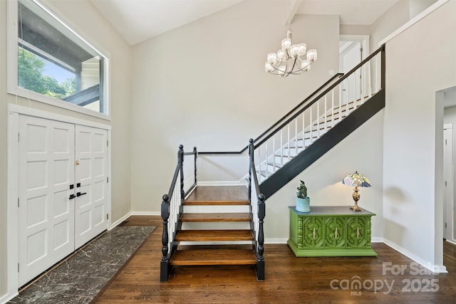 9334 Hunting Ct, Matthews, NC 28105 - foyer with a chandelier, wood finished floors, and stairs