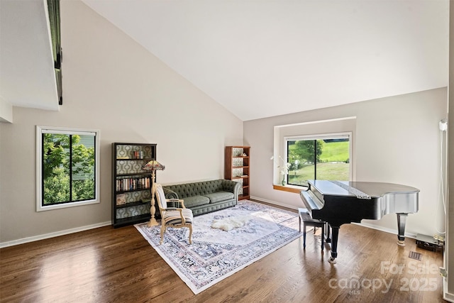 9334 Hunting Ct, Matthews, NC 28105 - living room featuring high vaulted ceiling and wood finished floors