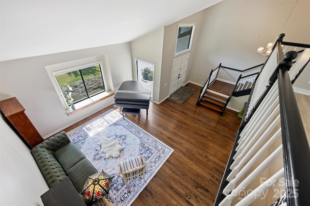 9334 Hunting Ct, Matthews, NC 28105 - living room featuring wood finished floors, stairs, and vaulted ceiling
