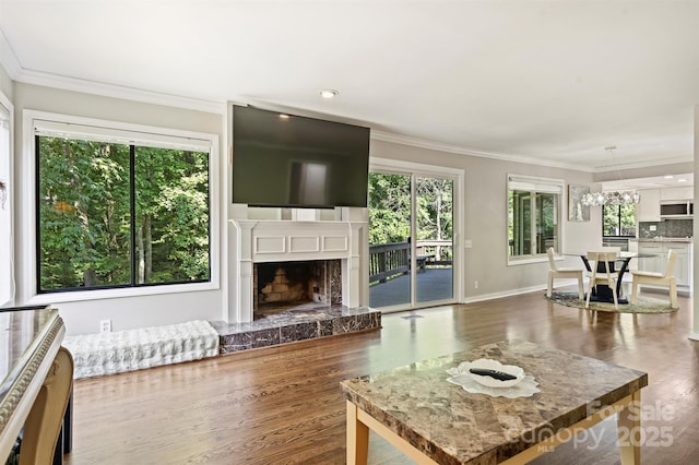 9334 Hunting Ct, Matthews, NC 28105 - living room with dark wood-type flooring, a fireplace, and crown molding