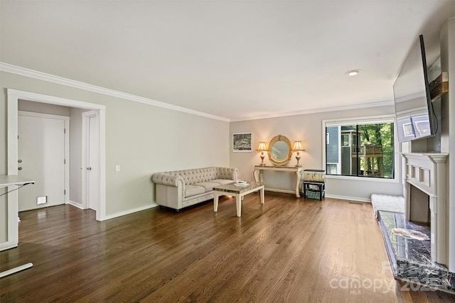 9334 Hunting Ct, Matthews, NC 28105 - living room featuring wood finished floors, crown molding, and a fireplace with raised hearth