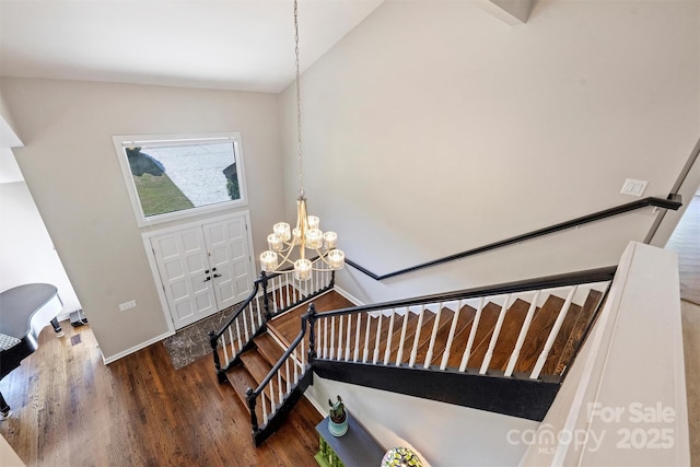 9334 Hunting Ct, Matthews, NC 28105 - foyer entrance featuring wood finished floors and a chandelier