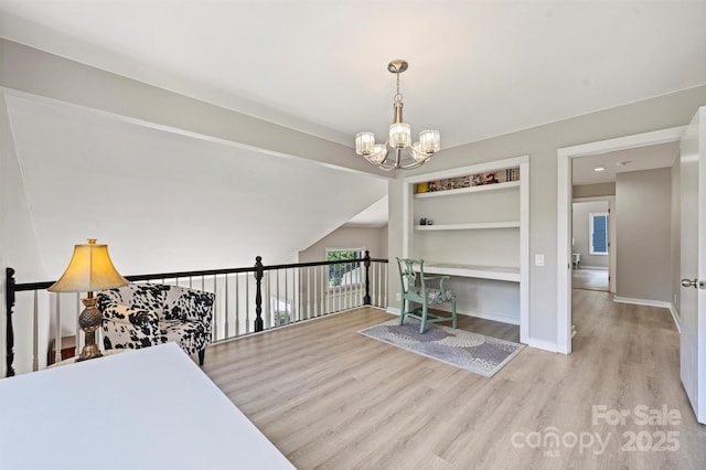 9334 Hunting Ct, Matthews, NC 28105 - interior space featuring wood finished floors, a chandelier, and built in shelves