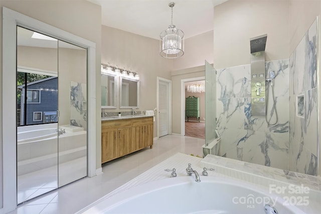 9334 Hunting Ct, Matthews, NC 28105 - bathroom with vanity, a bath, a chandelier, tile patterned flooring, and a walk in shower