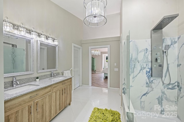 9334 Hunting Ct, Matthews, NC 28105 - ensuite bathroom with a chandelier, double vanity, a marble finish shower, and tile patterned flooring