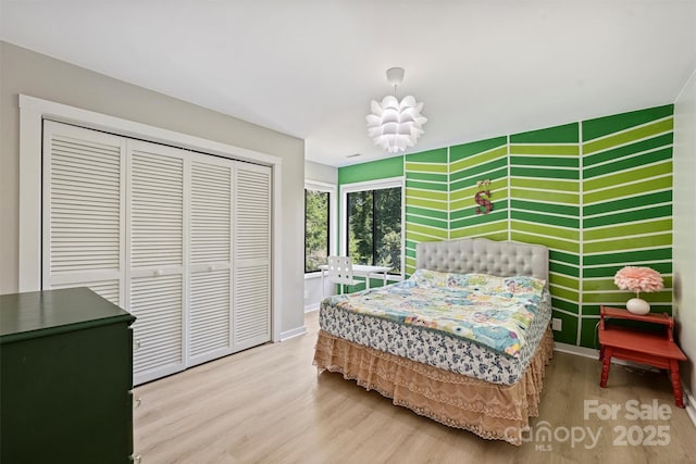 9334 Hunting Ct, Matthews, NC 28105 - bedroom featuring wood finished floors and a closet