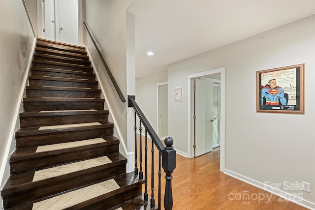 9334 Hunting Ct, Matthews, NC 28105 - stairs with wood finished floors and recessed lighting