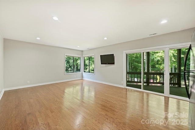9334 Hunting Ct, Matthews, NC 28105 - empty room with wood finished floors and recessed lighting
