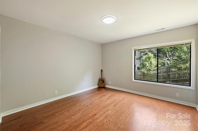 9334 Hunting Ct, Matthews, NC 28105 - spare room with wood finished floors and baseboards