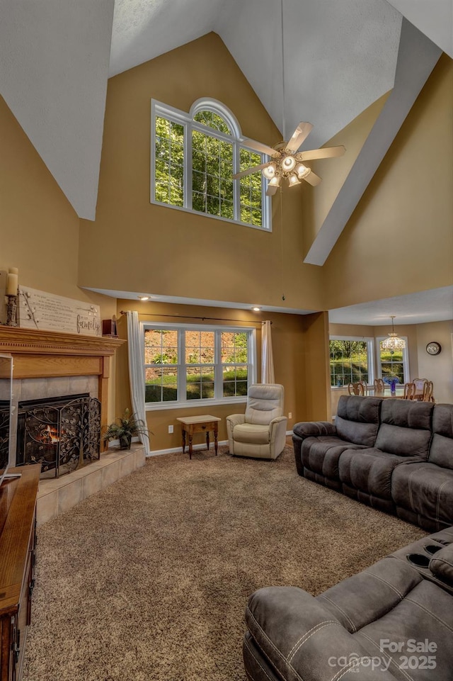 59 Old Lakey Gap Rd, Black Mountain, NC 28711 - carpeted living room featuring high vaulted ceiling, a ceiling fan, a fireplace, healthy amount of natural light, and a chandelier