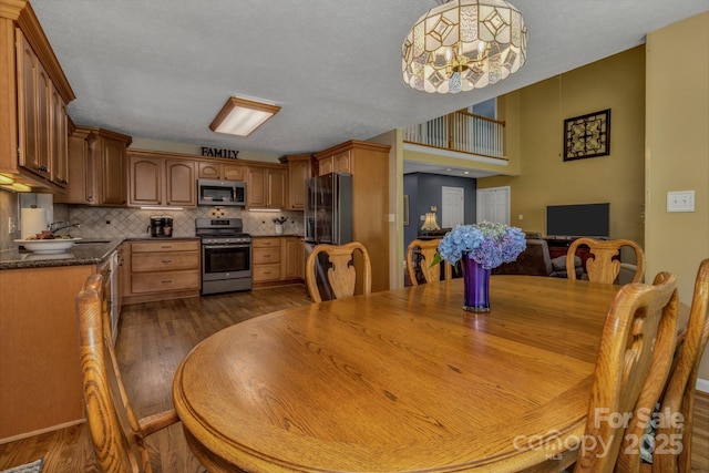 59 Old Lakey Gap Rd, Black Mountain, NC 28711 - dining space with dark wood-style flooring and a chandelier