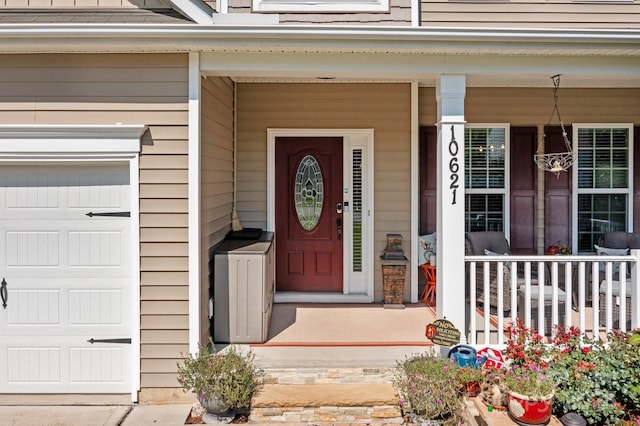 10621 Shanon Darby Ln, Charlotte, NC 28214 - view of exterior entry featuring a porch and a garage