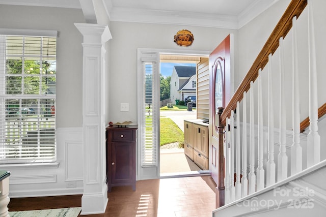 10621 Shanon Darby Ln, Charlotte, NC 28214 - foyer entrance featuring wood finished floors, stairs, wainscoting, and crown molding