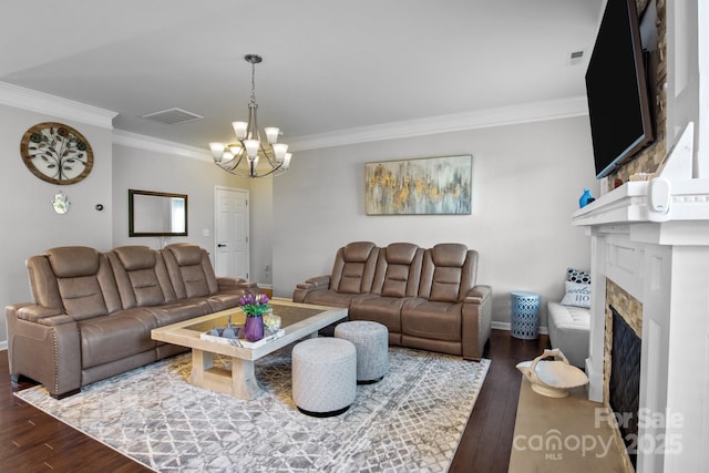 10621 Shanon Darby Ln, Charlotte, NC 28214 - living area with ornamental molding, wood finished floors, a chandelier, and a fireplace
