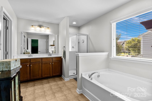 10621 Shanon Darby Ln, Charlotte, NC 28214 - bathroom with a stall shower, a bath, healthy amount of natural light, and double vanity
