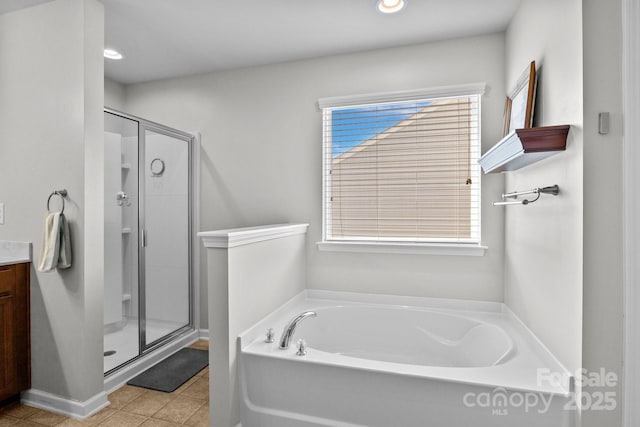 10621 Shanon Darby Ln, Charlotte, NC 28214 - full bathroom with a bath, a shower stall, vanity, and recessed lighting