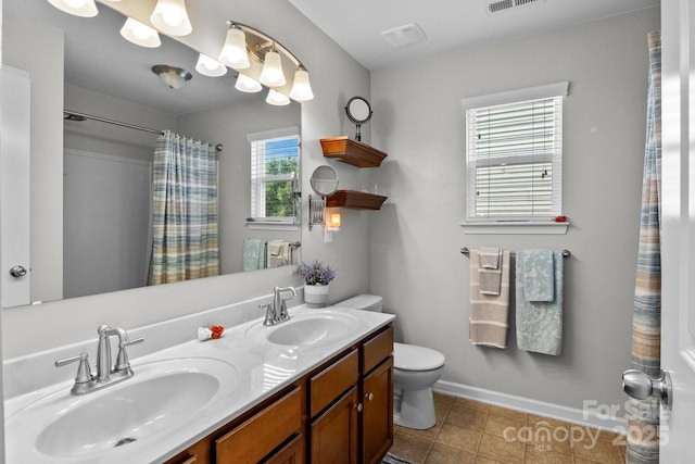 10621 Shanon Darby Ln, Charlotte, NC 28214 - bathroom featuring double vanity, curtained shower, and tile patterned flooring