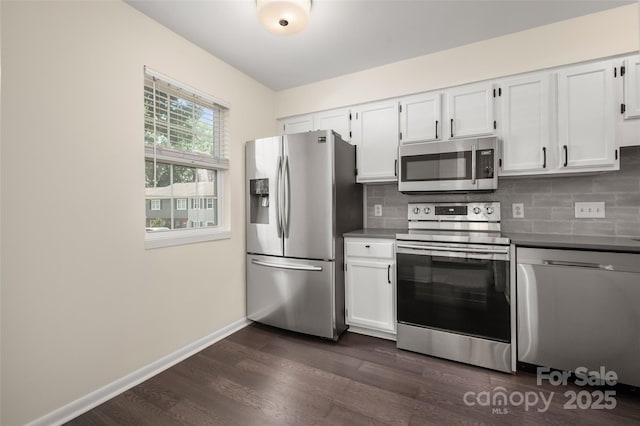 6013 Heath Valley Rd, Charlotte, NC 28210 - kitchen with appliances with stainless steel finishes, dark wood-type flooring, white cabinets, and decorative backsplash