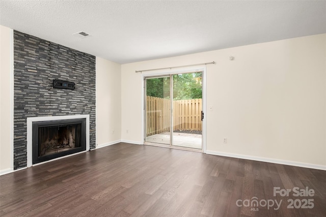 6013 Heath Valley Rd, Charlotte, NC 28210 - unfurnished living room with dark wood-type flooring and a tile fireplace