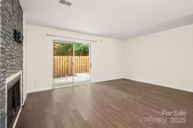 6013 Heath Valley Rd, Charlotte, NC 28210 - unfurnished living room featuring wood finished floors and a fireplace
