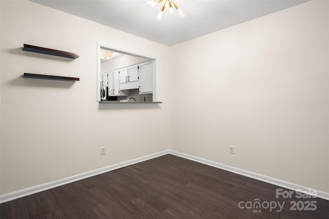 6013 Heath Valley Rd, Charlotte, NC 28210 - empty room with dark wood-style floors and baseboards