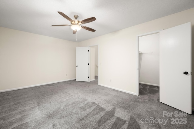 6013 Heath Valley Rd, Charlotte, NC 28210 - unfurnished bedroom featuring carpet floors, a walk in closet, and ceiling fan
