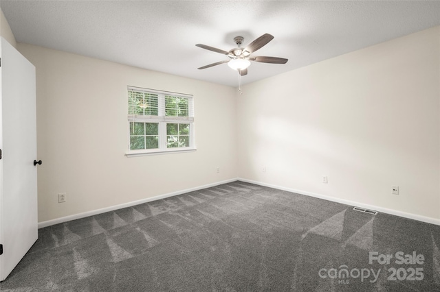 6013 Heath Valley Rd, Charlotte, NC 28210 - empty room with ceiling fan and dark colored carpet