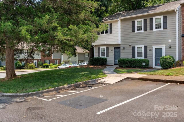 6013 Heath Valley Rd, Charlotte, NC 28210 - view of property featuring uncovered parking and a front yard