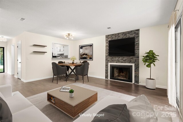 6013 Heath Valley Rd, Charlotte, NC 28210 - living area featuring wood finished floors and a large fireplace