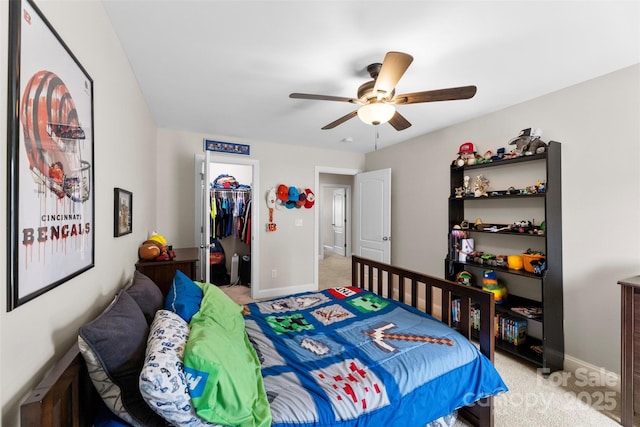 116 Kentmere Ln, Clover, SC 29710 - bedroom with light carpet, a walk in closet, a closet, and ceiling fan