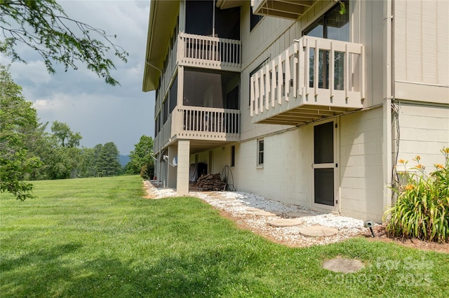 175 Glen Cannon Pt Unit 2, Pisgah Forest, NC 28768 - rear view of property with a lawn and a balcony