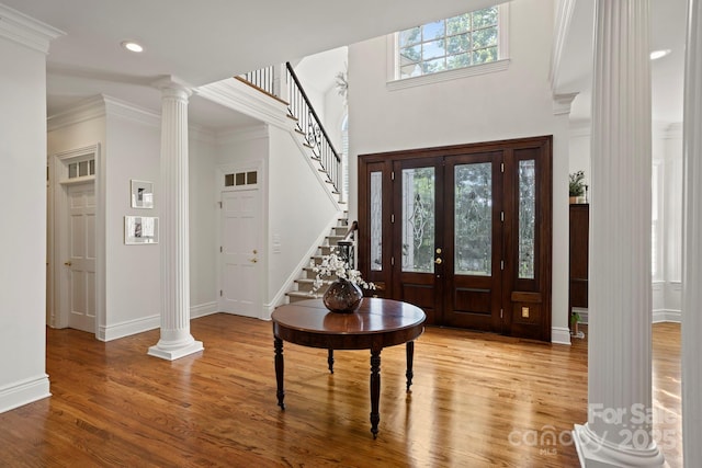 117 Founders Dr, Flat Rock, NC 28731 - entrance foyer featuring wood finished floors, stairs, ornate columns, recessed lighting, and ornamental molding