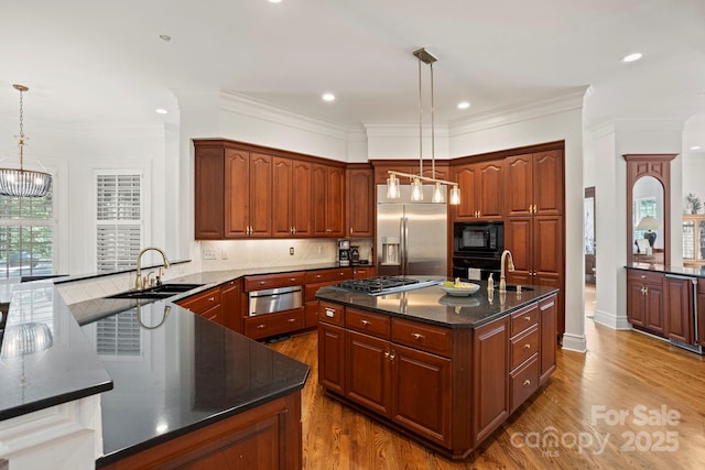 117 Founders Dr, Flat Rock, NC 28731 - kitchen with black appliances, a warming drawer, dark wood-type flooring, a center island with sink, and tasteful backsplash
