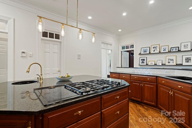 117 Founders Dr, Flat Rock, NC 28731 - kitchen with black stovetop, a center island, ornamental molding, light wood-style floors, and recessed lighting