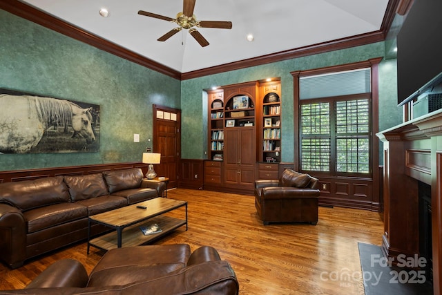 117 Founders Dr, Flat Rock, NC 28731 - living room with a fireplace with flush hearth, ornamental molding, a ceiling fan, wood finished floors, and vaulted ceiling