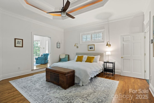 117 Founders Dr, Flat Rock, NC 28731 - bedroom with multiple windows, a raised ceiling, ornamental molding, wood finished floors, and a ceiling fan