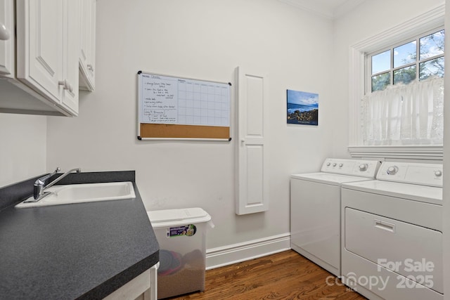 117 Founders Dr, Flat Rock, NC 28731 - washroom featuring washer and clothes dryer, cabinet space, dark wood-style flooring, and ornamental molding