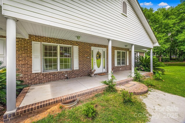 1010 Rainbow Cir, Catawba, SC 29704 - view of exterior entry featuring covered porch and brick siding