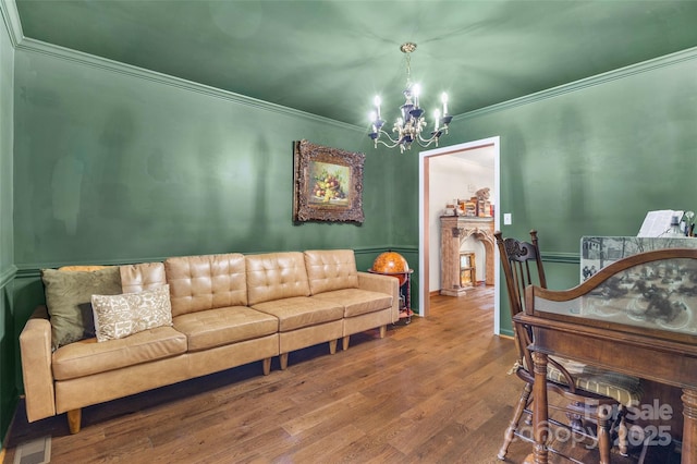 1010 Rainbow Cir, Catawba, SC 29704 - living area featuring a chandelier, ornamental molding, wood finished floors, and a fireplace