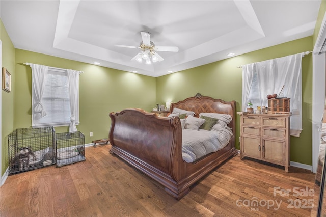 1010 Rainbow Cir, Catawba, SC 29704 - bedroom featuring a raised ceiling, wood finished floors, ceiling fan, and recessed lighting