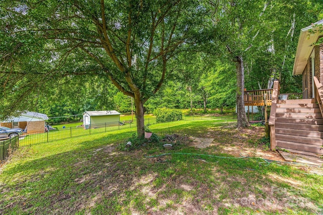 1010 Rainbow Cir, Catawba, SC 29704 - fenced backyard with a wooden deck and stairway