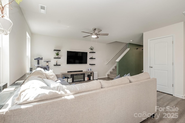 1478 Cannan Mountain Dr, Newton, NC 28658 - living room with a ceiling fan, stairway, and light wood-type flooring