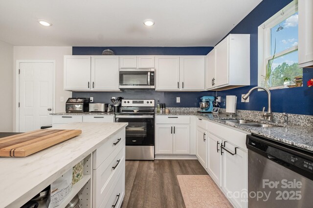 1478 Cannan Mountain Dr, Newton, NC 28658 - kitchen with stainless steel appliances, dark wood-style floors, light stone counters, white cabinetry, and recessed lighting