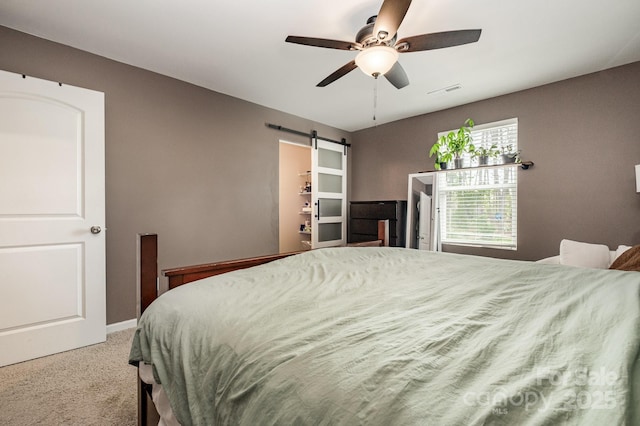 1478 Cannan Mountain Dr, Newton, NC 28658 - bedroom with carpet floors, a barn door, and ceiling fan
