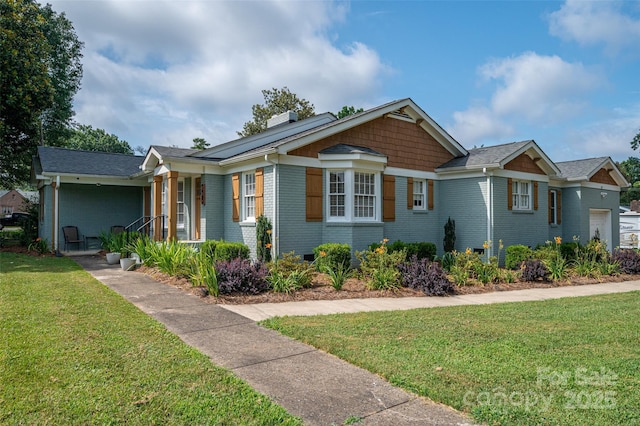 806 S Point Rd, Belmont, NC 28012 - view of front of property featuring brick siding, a chimney, a front lawn, and a porch