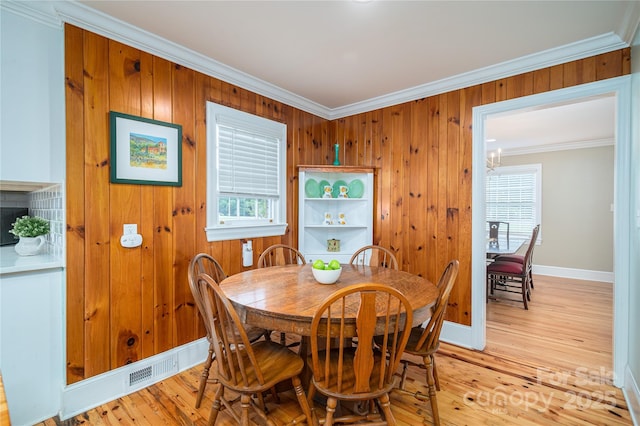 806 S Point Rd, Belmont, NC 28012 - dining room with ornamental molding, light wood-style floors, and wooden walls