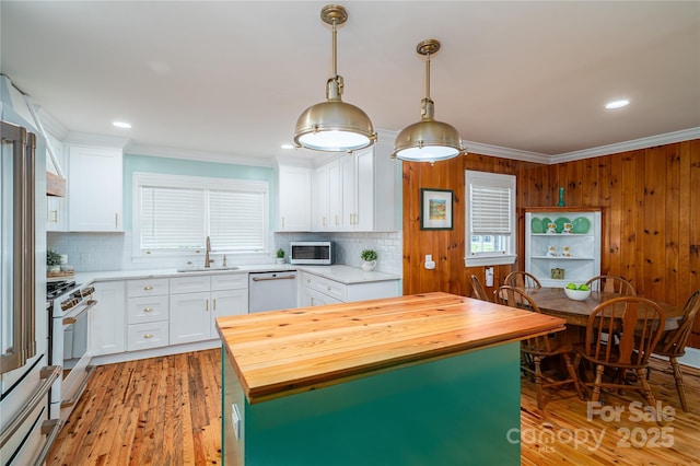 806 S Point Rd, Belmont, NC 28012 - kitchen featuring wooden counters, white appliances, ornamental molding, white cabinetry, and backsplash