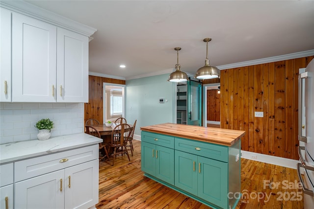 806 S Point Rd, Belmont, NC 28012 - kitchen with butcher block counters, crown molding, white cabinetry, decorative backsplash, and light wood-style floors